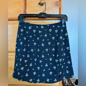 Black floral mini skirt